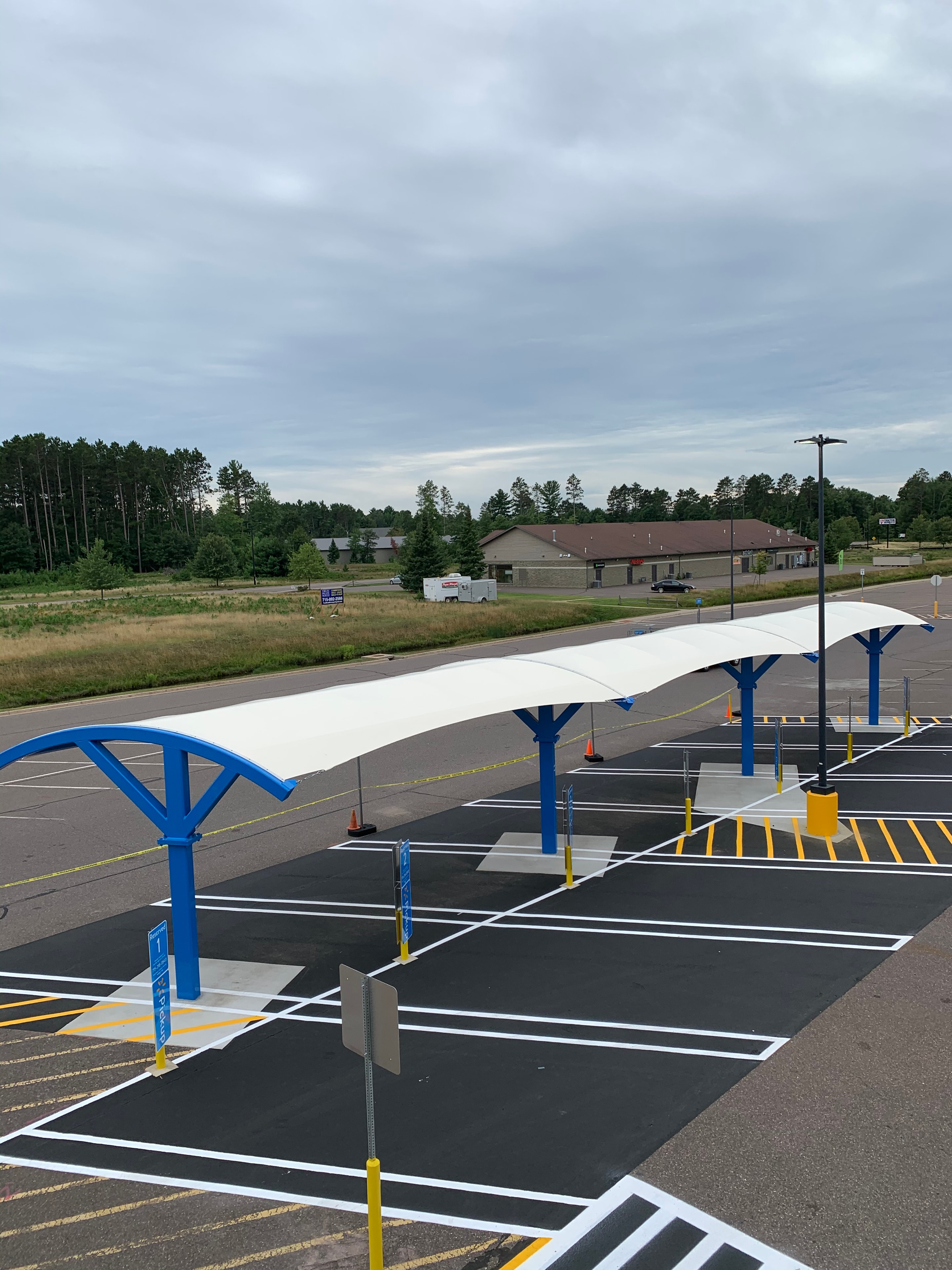 Walmart grocery pickup parking lot line striping — Minocqua, WI